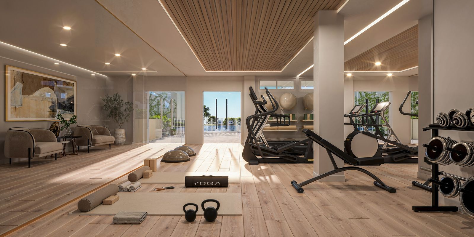 Nowoczesna domowa siłownia z dużymi oknami, sprzętem do ćwiczeń i widokiem na zewnątrz.